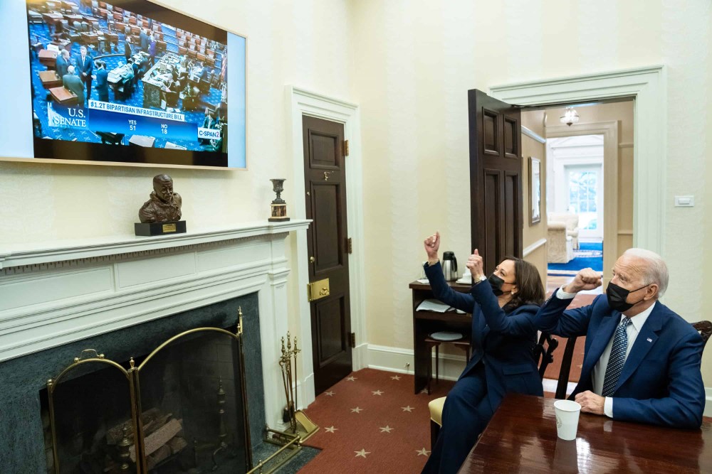 President Joe Biden and Vice President Kamala Harris watch the “Yes” vote reach 51 in the U.S. Senate on the $1.2 trillion bipartisan infrastructure bill, Tuesday, August 10, 2021, in the Oval Office Dining Room of the White House.