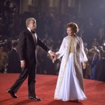 President Jimmy Carter and First Lady Rosalynn Carter holding hands on stage at their inaugural ball.