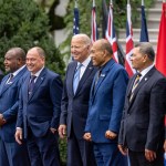 President Biden standing among leaders of Pacific Island nations