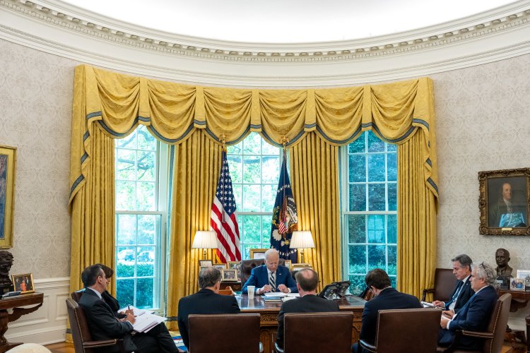President Joe Biden speaks on the phone with Prime Minister Benjamin Netanyahu of Israel in the Oval Office
