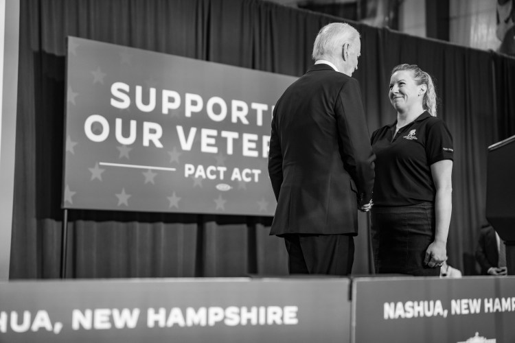 PACT Act beneficiary Master Sergeant Nicole Lyon introduces President Joe Biden at a PACT Act event