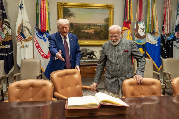 Prime Minister Narendra Modi of India signs the guest book in the Roosevelt Room, Thursday, February 13, 2025, before a bilateral meeting with President Donald Trump in the Oval Office. (Official White House Photo by Joyce N. Boghosian.)