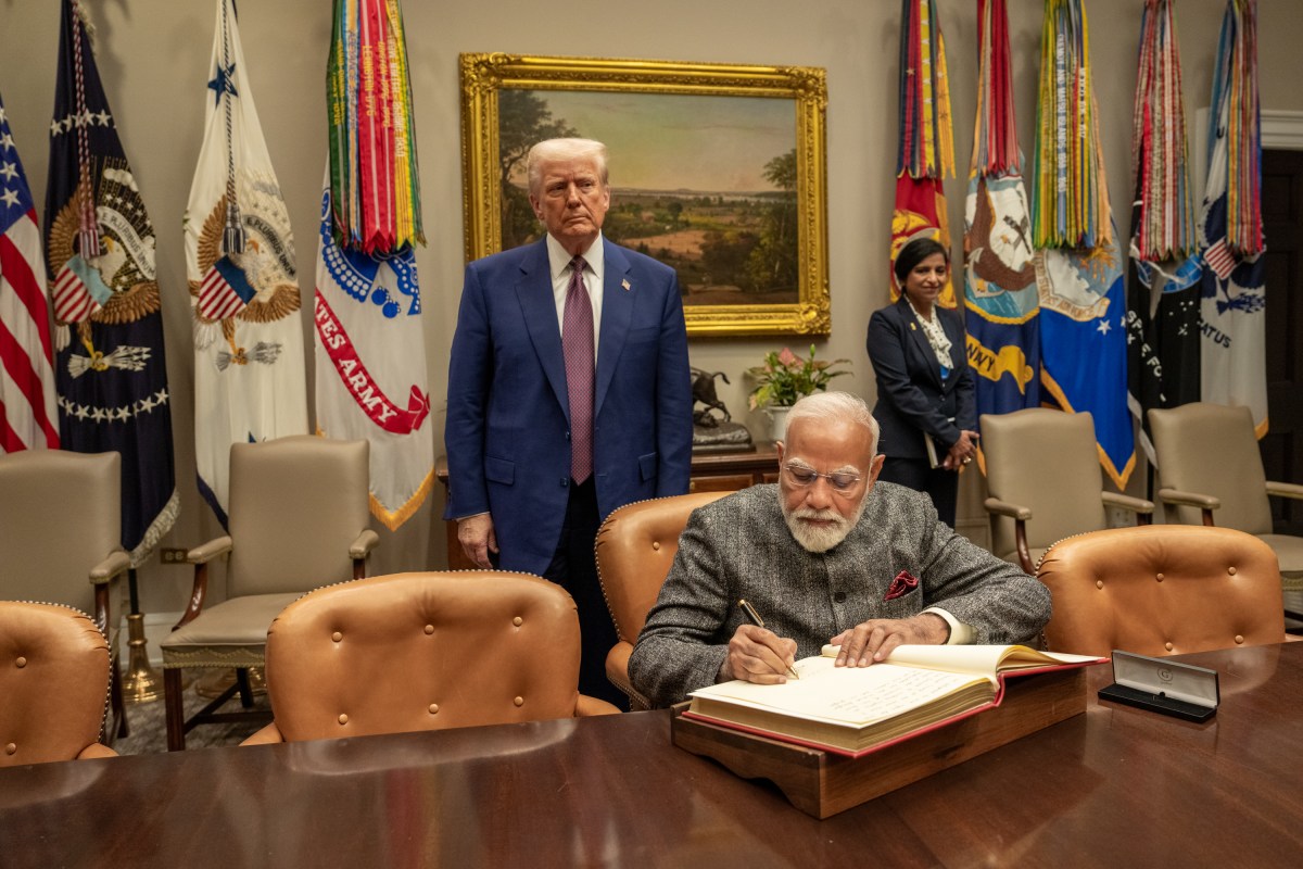 Prime Minister Narendra Modi of India signs the guest book in the Roosevelt Room, Thursday, February 13, 2025, before a bilateral meeting with President Donald Trump in the Oval Office. (Official White House Photo by Joyce N. Boghosian.)