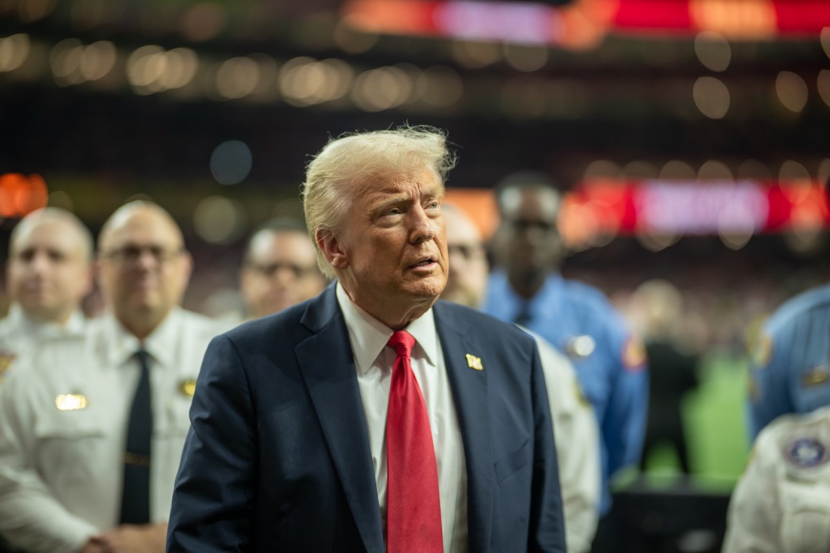 President Donald Trump greets honorary coin toss participants, including family members of the victims from the New Years terrorist attack, members of the New Orleans Police Department and emergency personnel at Caesars Superdome in New Orleans, Louisiana, Sunday, February 9, 2025, before the start of Superbowl LIX between the Philadelphia Eagles and the Kansas City Chiefs. (Official White House photo by Daniel Torok)