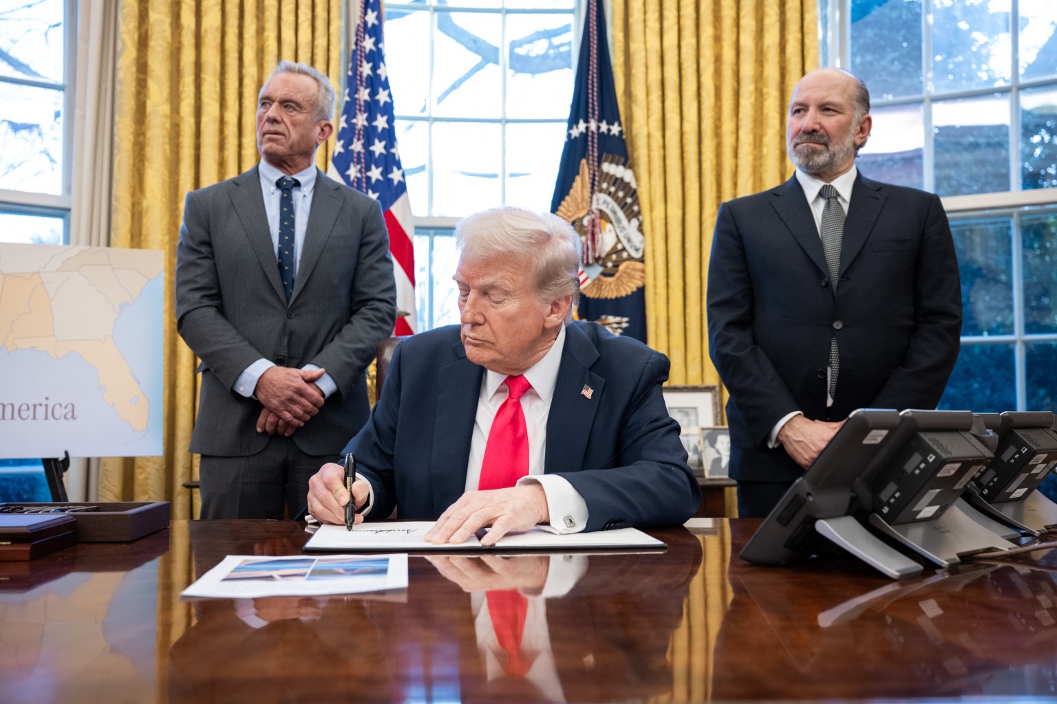 President Donald Trump signs executive orders in the Oval Office, Tuesday, February 25, 2025. 