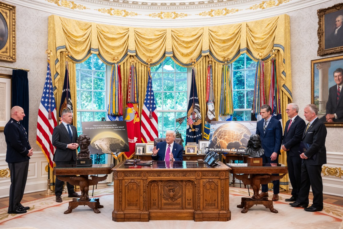 President Donald Trump speaks with Secretary of Defense Pete Hegseth, Space Force Vice Chief of Operations Michael Guetlein, and others after the announcement of the Golden Dome missile defense system, Tuesday, May 20, 2025, in the Oval Office. (Official White House Photo by Joyce N. Boghosian)