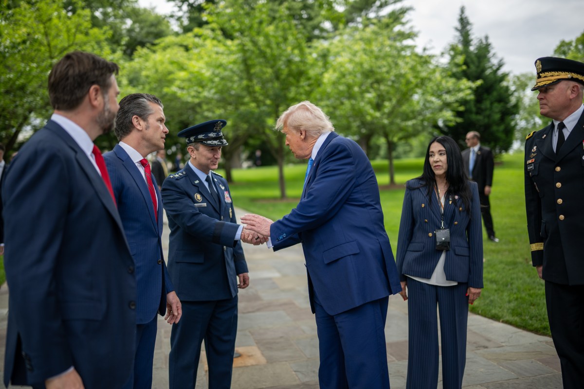 President Donald Trump speaks with members of the military before departing Arlington National Cemetery in Arlington, Virginia after participating in Memorial Day ceremonies, Monday, May 26, 2025. (Official White House Photo by Daniel Torok)