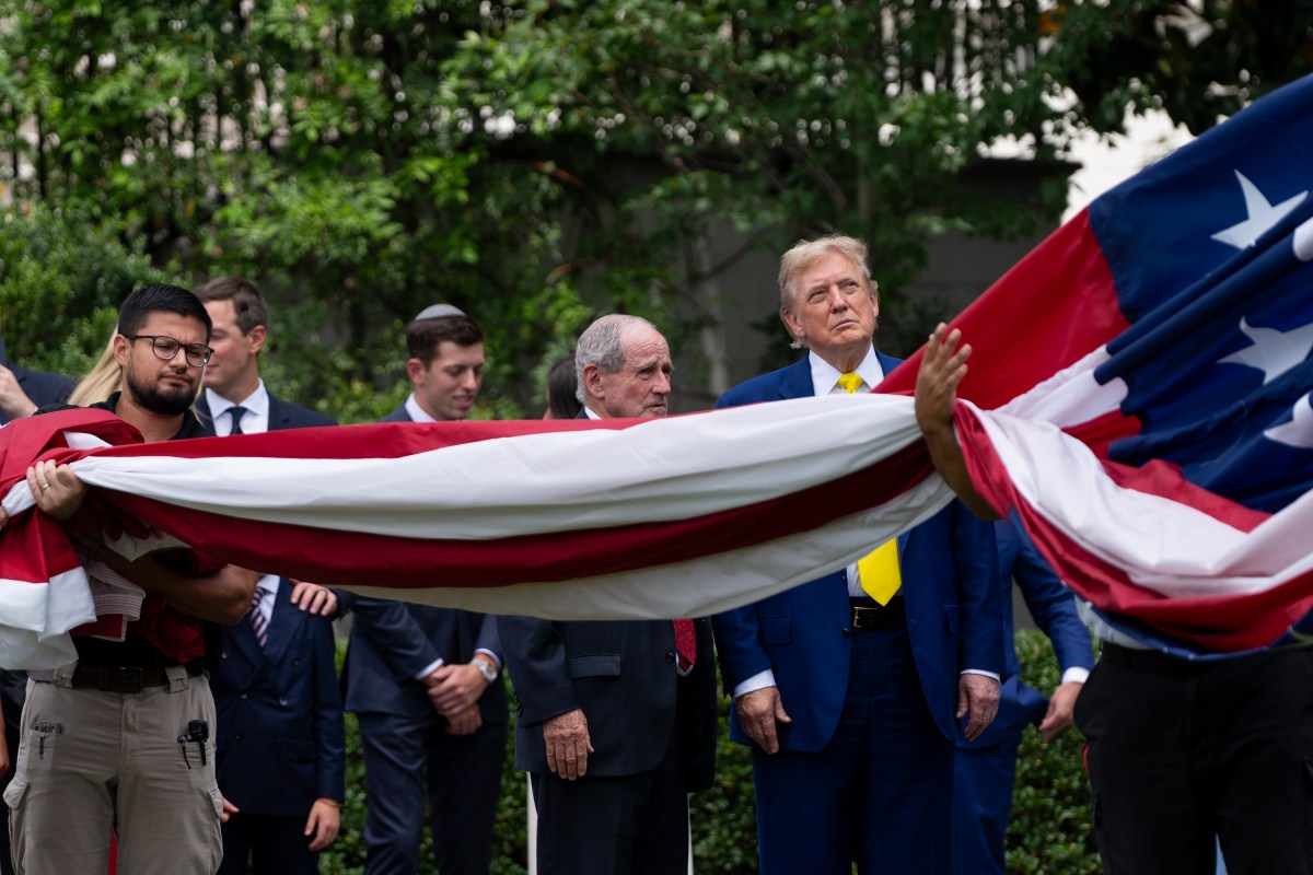 President Donald Trump watches the United States flag is raised on the newly installed flagpole on the South Lawn of the White House, Wednesday, June 18, 2025. (Official White House Photo by Andrea Hanks)