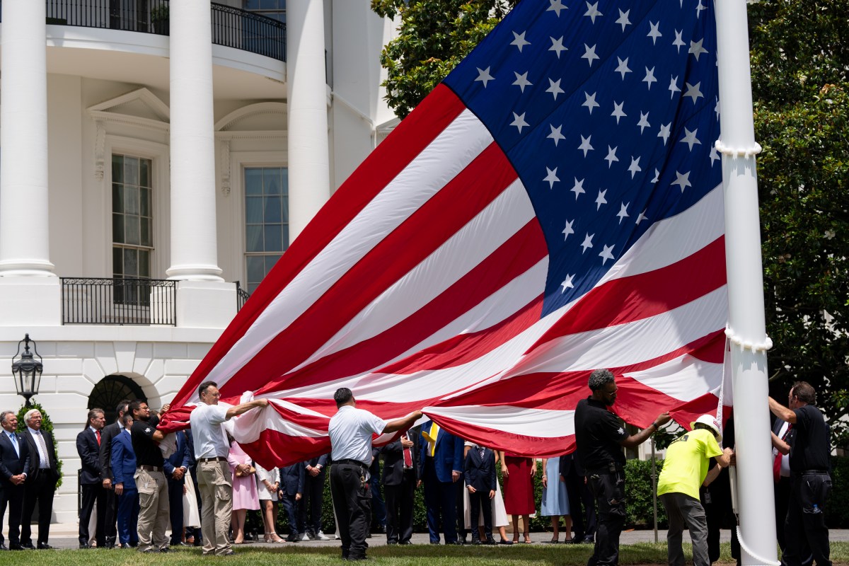 President Donald Trump watches the United States flag is raised on the newly installed flagpole on the South Lawn of the White House, Wednesday, June 18, 2025. (Official White House Photo by Andrea Hanks)
