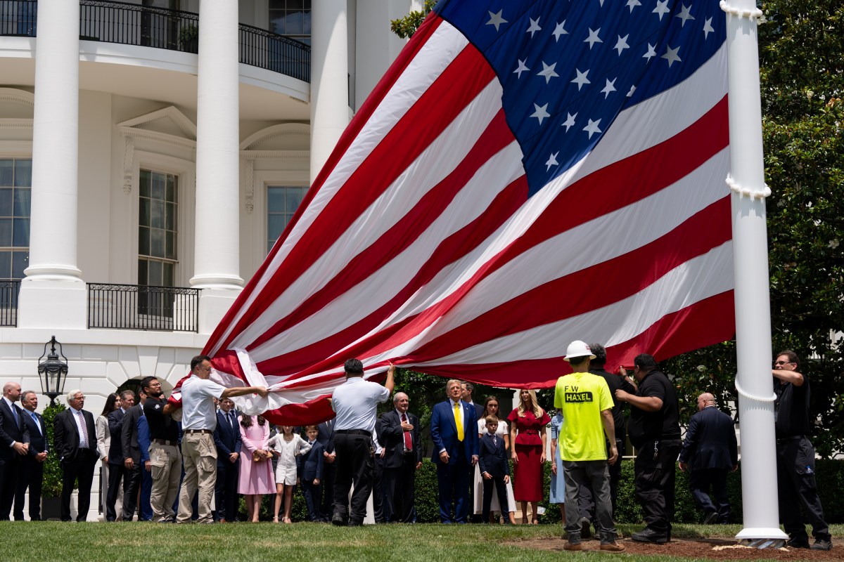 President Donald Trump watches the United States flag is raised on the newly installed flagpole on the South Lawn of the White House, Wednesday, June 18, 2025. (Official White House Photo by Andrea Hanks)