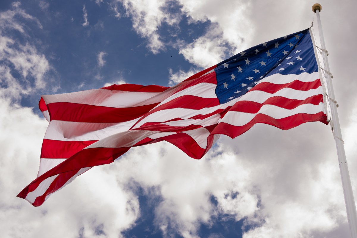 President Donald Trump watches the United States flag is raised on the newly installed flagpole on the South Lawn of the White House, Wednesday, June 18, 2025. (Official White House Photo by Andrea Hanks)