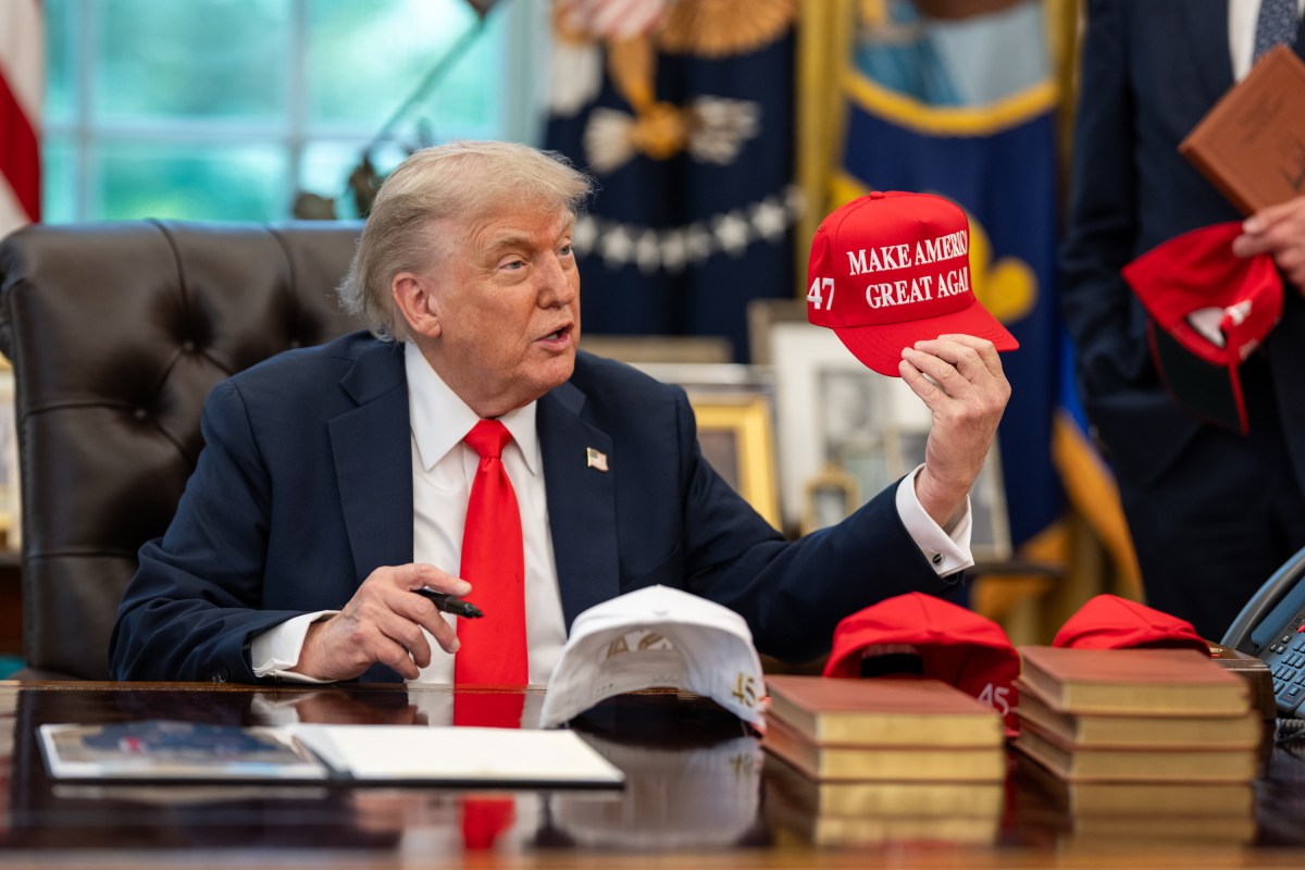 President Donald Trump exchanges gifts with German Chancellor Friedrich Merz, Thursday, June 5, 2025, in the Oval Office. (Official White House Photo by Daniel Torok)