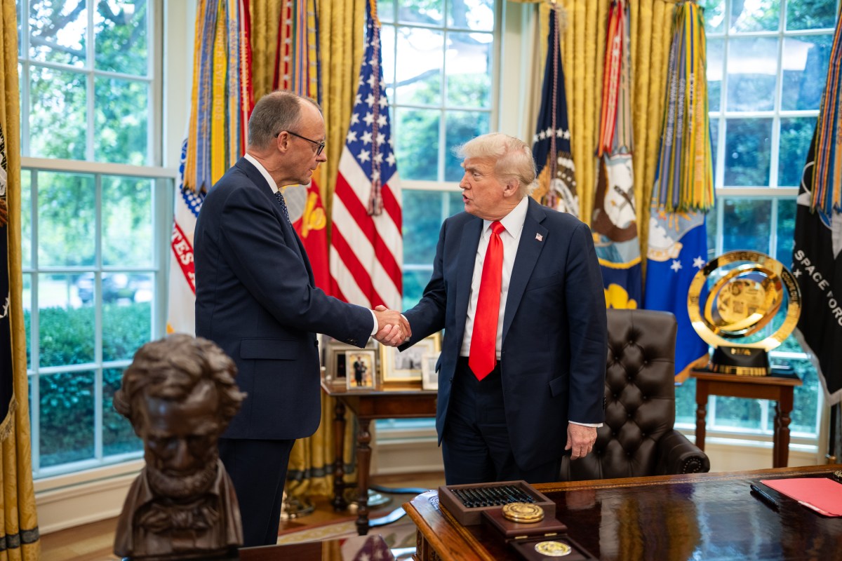 President Donald Trump exchanges gifts with German Chancellor Friedrich Merz, Thursday, June 5, 2025, in the Oval Office. (Official White House Photo by Daniel Torok)