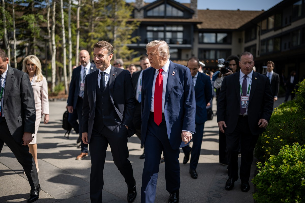 President Donald Trump talks with French President Emmanuel Macron before a welcome ceremony at the G7 Summit, Monday, June 16, 2025, in Kananaskis, Alberta, Canada. (Official White House Photo by Daniel Torok)