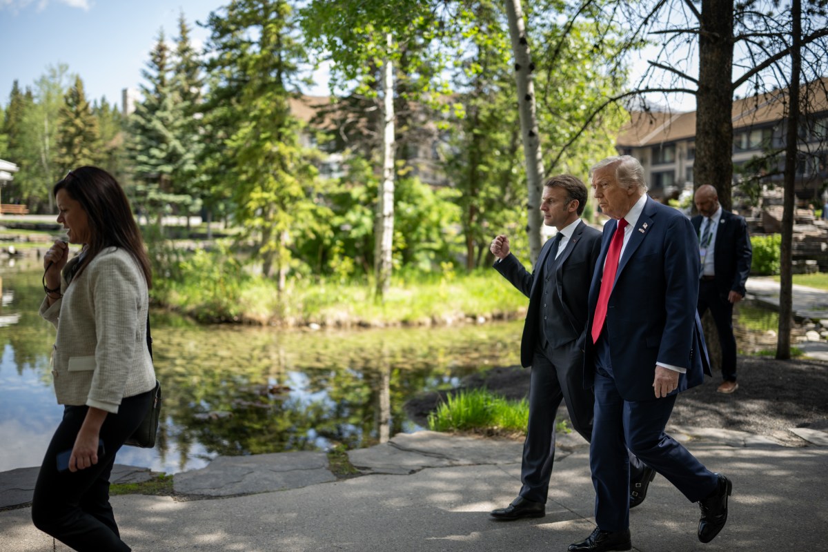 President Donald Trump talks with French President Emmanuel Macron before a welcome ceremony at the G7 Summit, Monday, June 16, 2025, in Kananaskis, Alberta, Canada. (Official White House Photo by Daniel Torok)