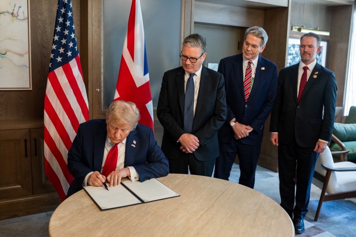 President Donald Trump signs a US-UK trade deal next to British Prime Minister Keir Starmer and Secretary of Treasury Scott Bessent at the G7 Summit, Monday, June 16, 2025, in Kananaskis, Alberta, Canada. (Official White House Photo by Daniel Torok)