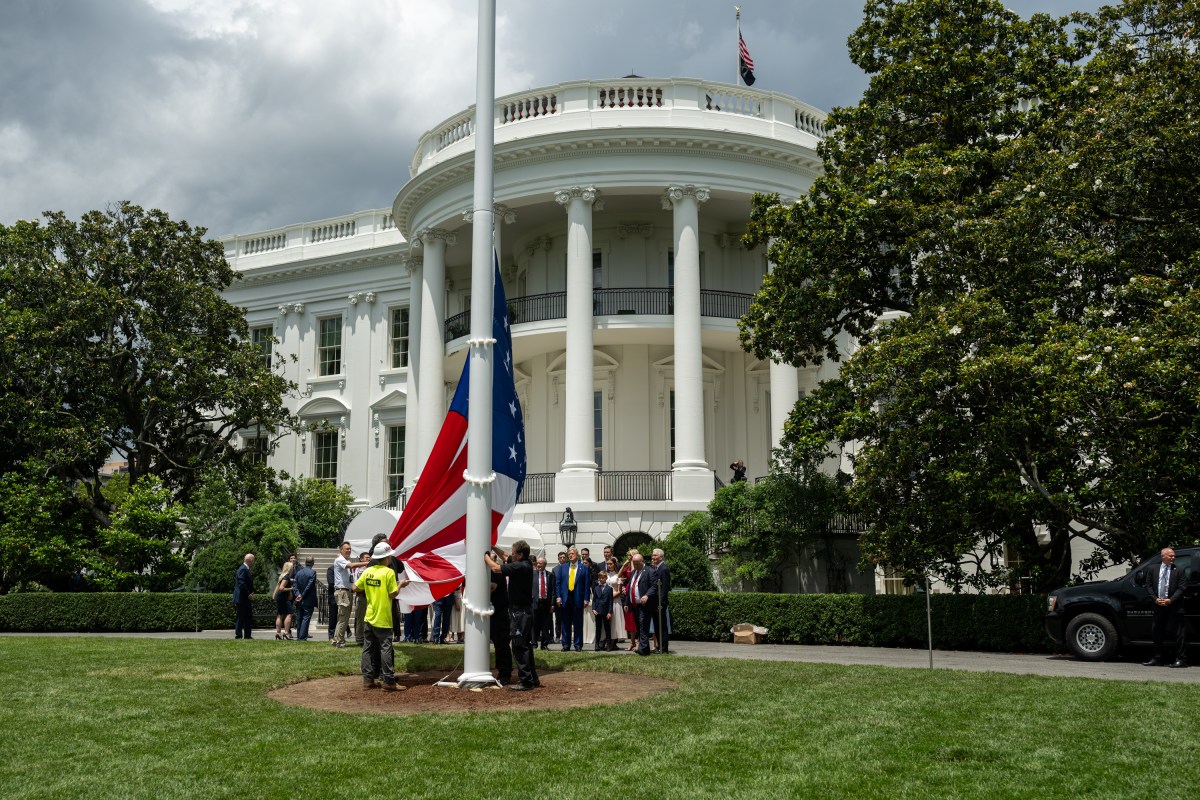 President Donald Trump watches as the American flag is raised on the newly-installed flagpole on the South Lawn of the White House, Wednesday, June 18, 2025. (Official White House Photo by Daniel Torok)