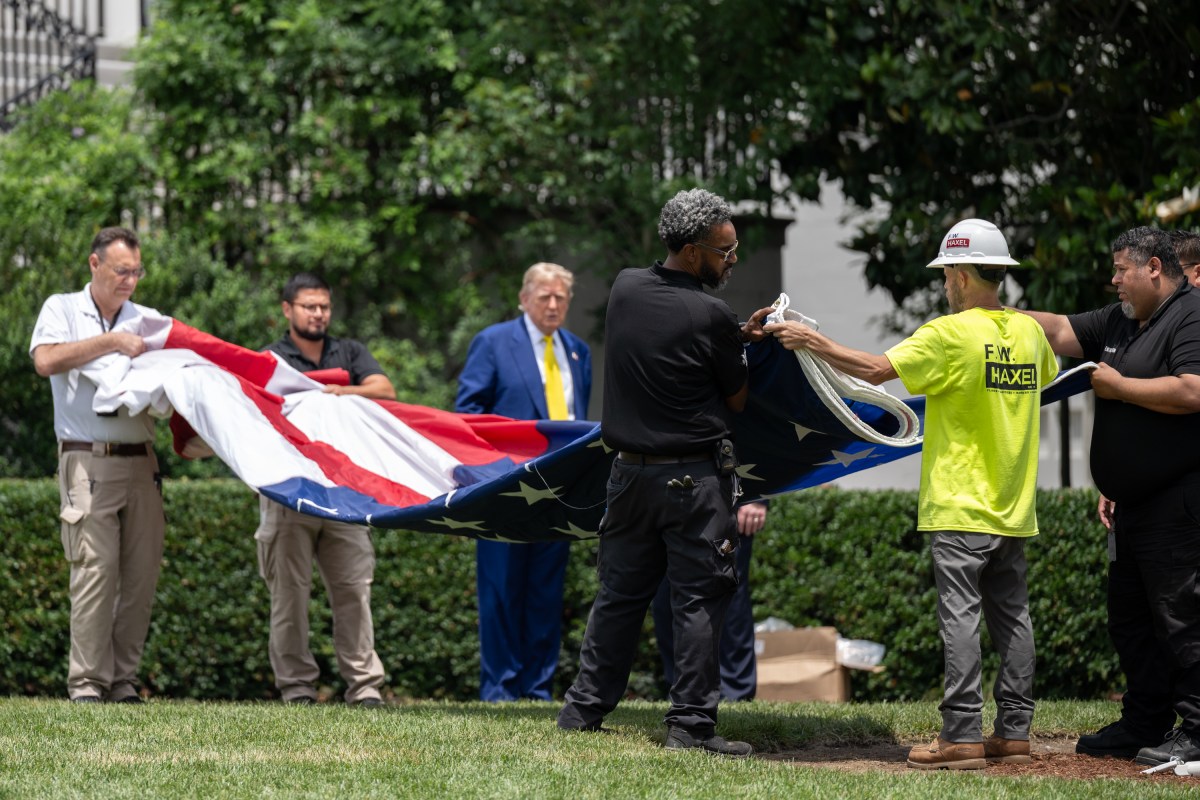 President Donald Trump watches as the American flag is raised on the newly-installed flagpole on the South Lawn of the White House, Wednesday, June 18, 2025. (Official White House Photo by Molly Riley)