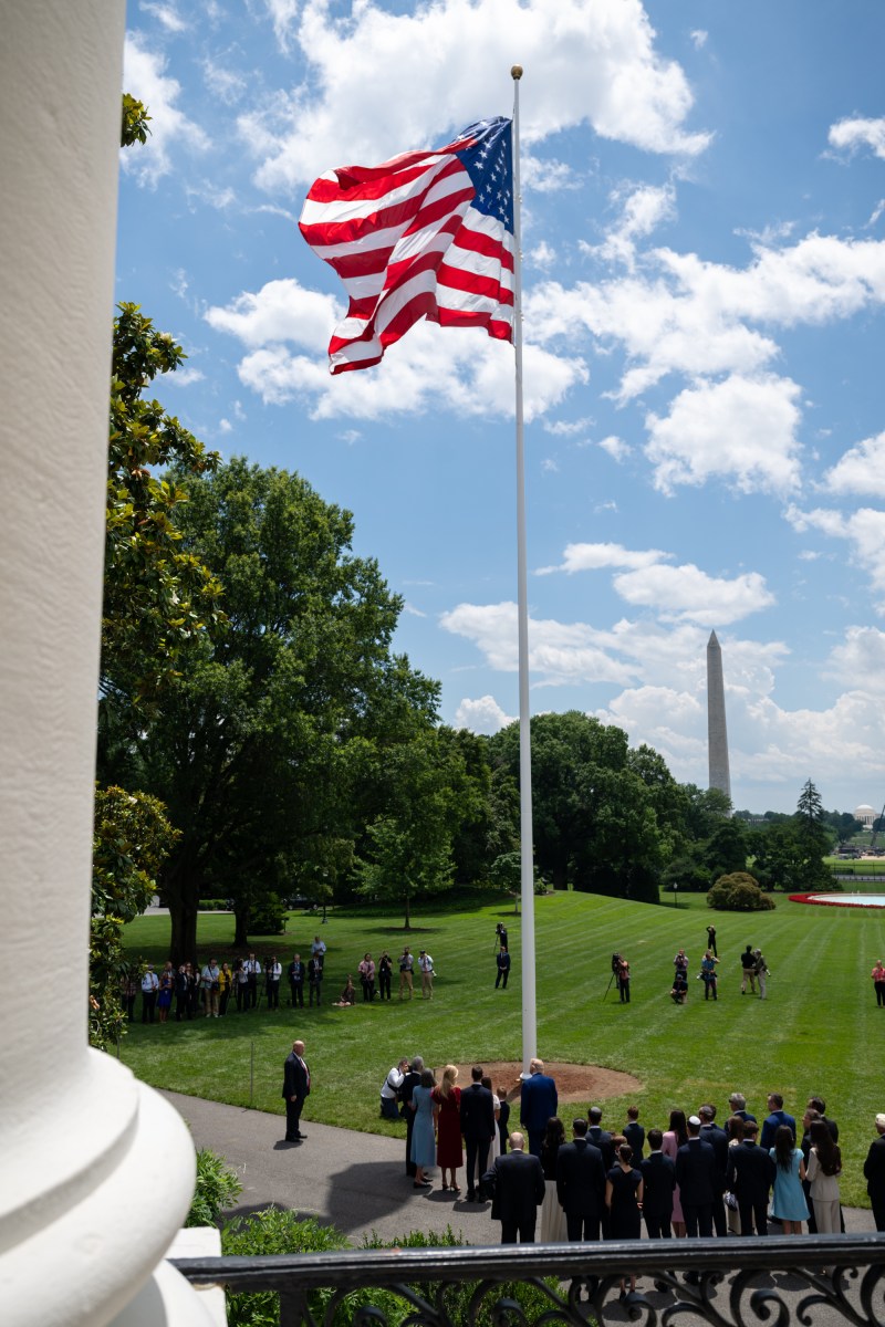 President Donald Trump watches as the American flag is raised on the newly-installed flagpole on the South Lawn of the White House, Wednesday, June 18, 2025. (Official White House Photo by Molly Riley)
