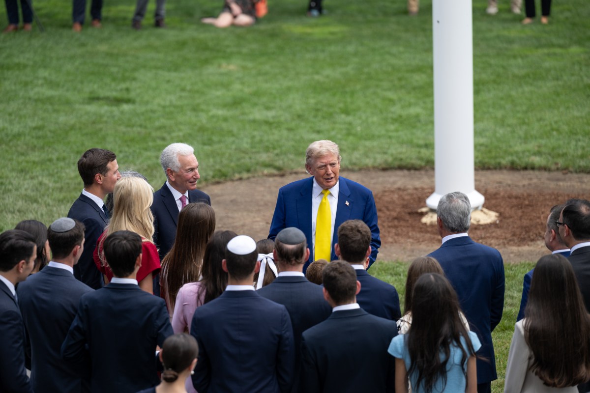 President Donald Trump watches as the American flag is raised on the newly-installed flagpole on the South Lawn of the White House, Wednesday, June 18, 2025. (Official White House Photo by Molly Riley)