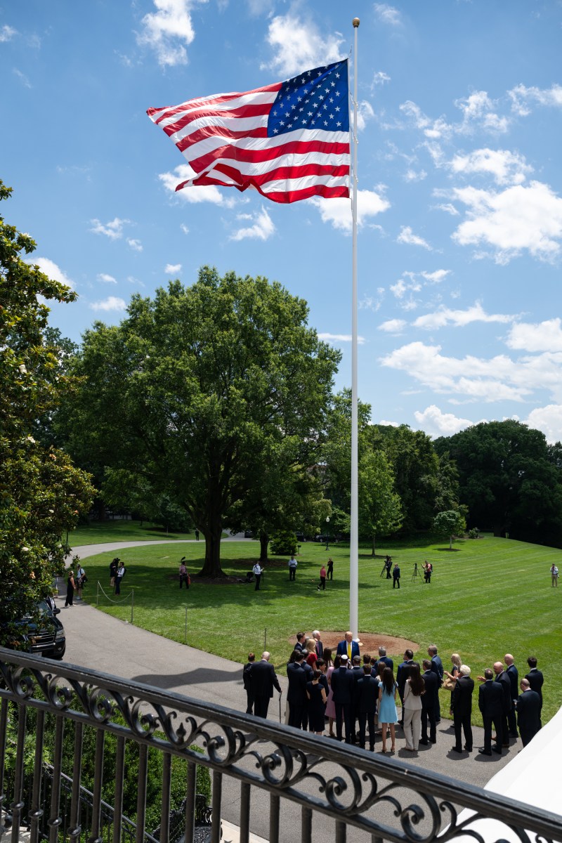 President Donald Trump watches as the American flag is raised on the newly-installed flagpole on the South Lawn of the White House, Wednesday, June 18, 2025. (Official White House Photo by Molly Riley)