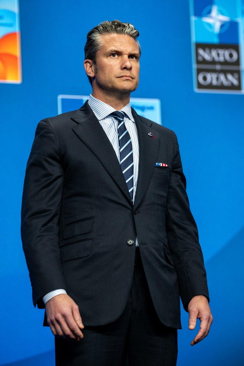 Secretary of Defense Pete Hegseth looks on as President Donald Trump participates in a press conference, Wednesday, June 25, 2025, during the 2025 NATO Summit at the World Forum in The Hague, Netherlands. (Official White House Photo by Daniel Torok)