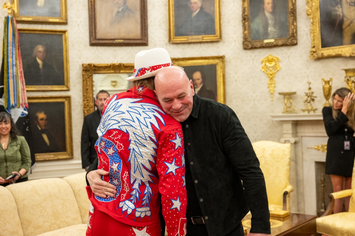 President Donald Trump signs an Executive Order alongside Kid Rock in the Oval Office, Monday, March 31, 2025. (Official White House Photo by Molly Riley)