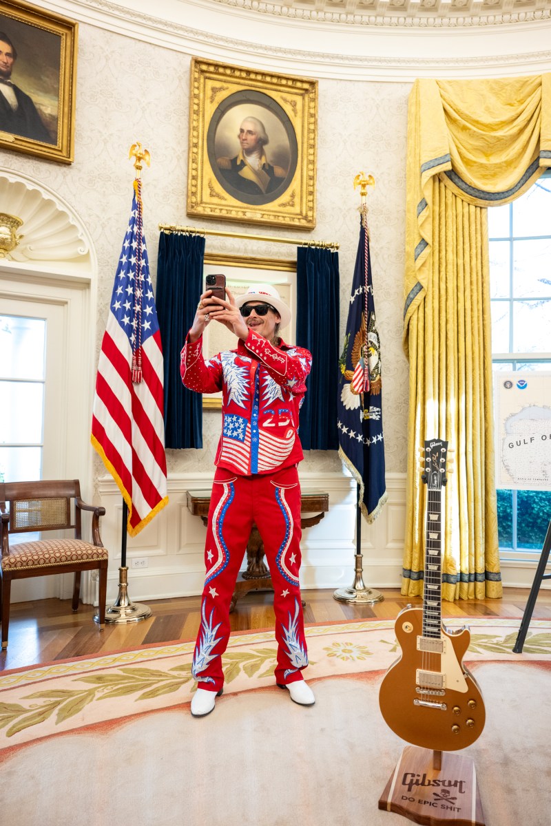 President Donald Trump signs an Executive Order alongside Kid Rock in the Oval Office, Monday, March 31, 2025. (Official White House Photo by Molly Riley)