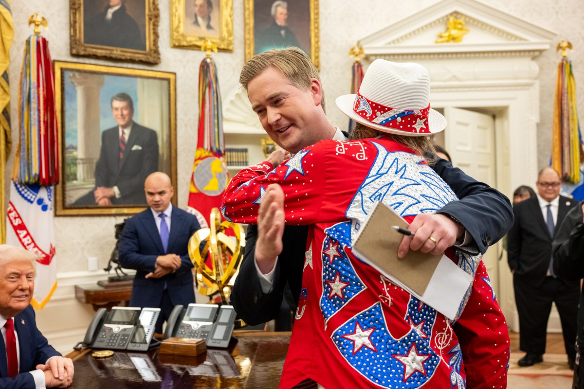 President Donald Trump signs an Executive Order alongside Kid Rock in the Oval Office, Monday, March 31, 2025. (Official White House Photo by Molly Riley)