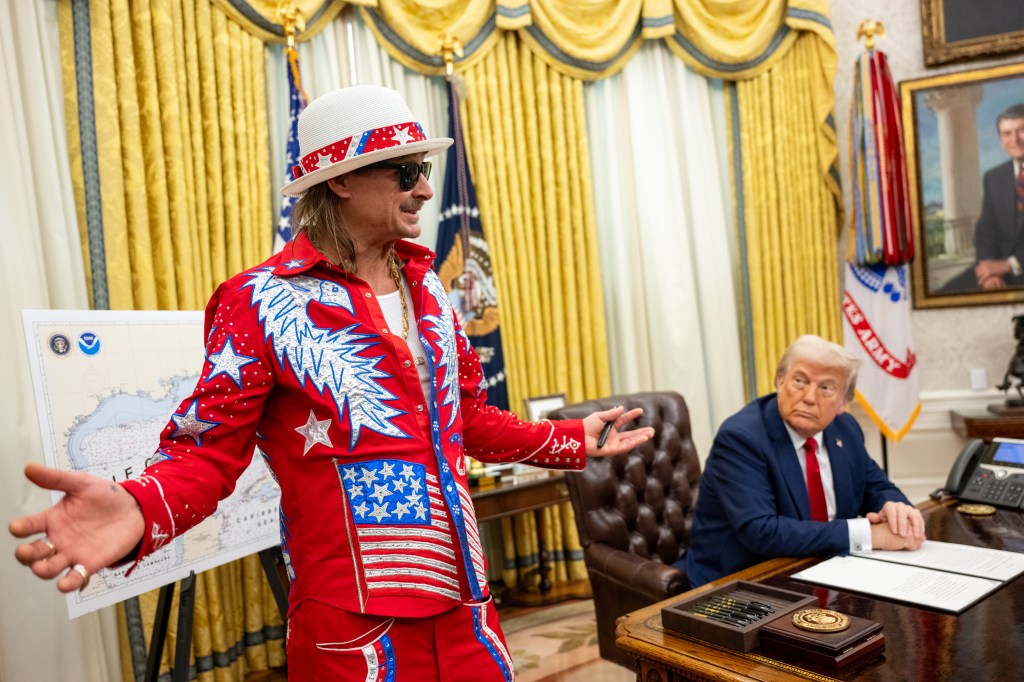President Donald Trump signs an Executive Order alongside Kid Rock in the Oval Office, Monday, March 31, 2025. (Official White House Photo by Molly Riley)