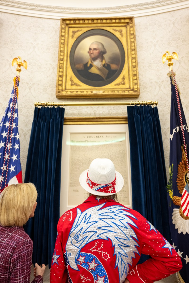 President Donald Trump signs an Executive Order alongside Kid Rock in the Oval Office, Monday, March 31, 2025. (Official White House Photo by Molly Riley)