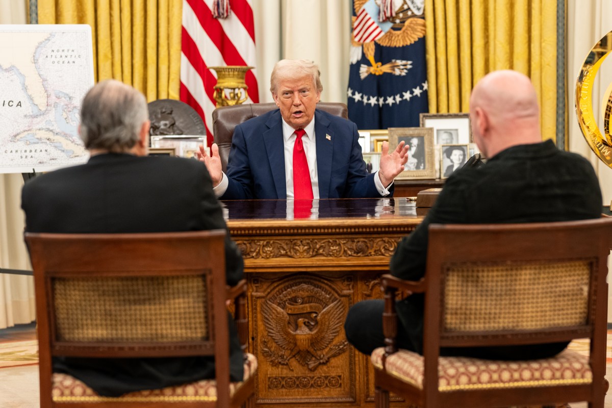 President Donald Trump signs an Executive Order alongside Kid Rock in the Oval Office, Monday, March 31, 2025. (Official White House Photo by Molly Riley)