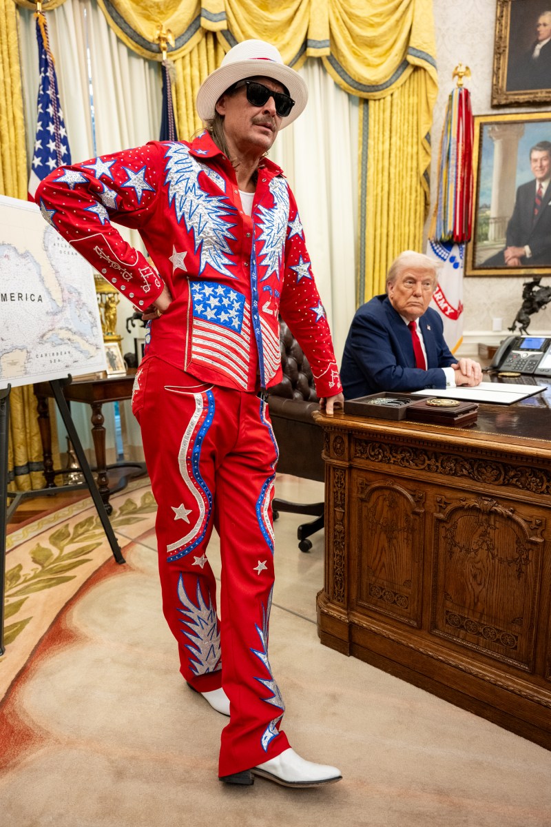 President Donald Trump signs an Executive Order alongside Kid Rock in the Oval Office, Monday, March 31, 2025. (Official White House Photo by Molly Riley)