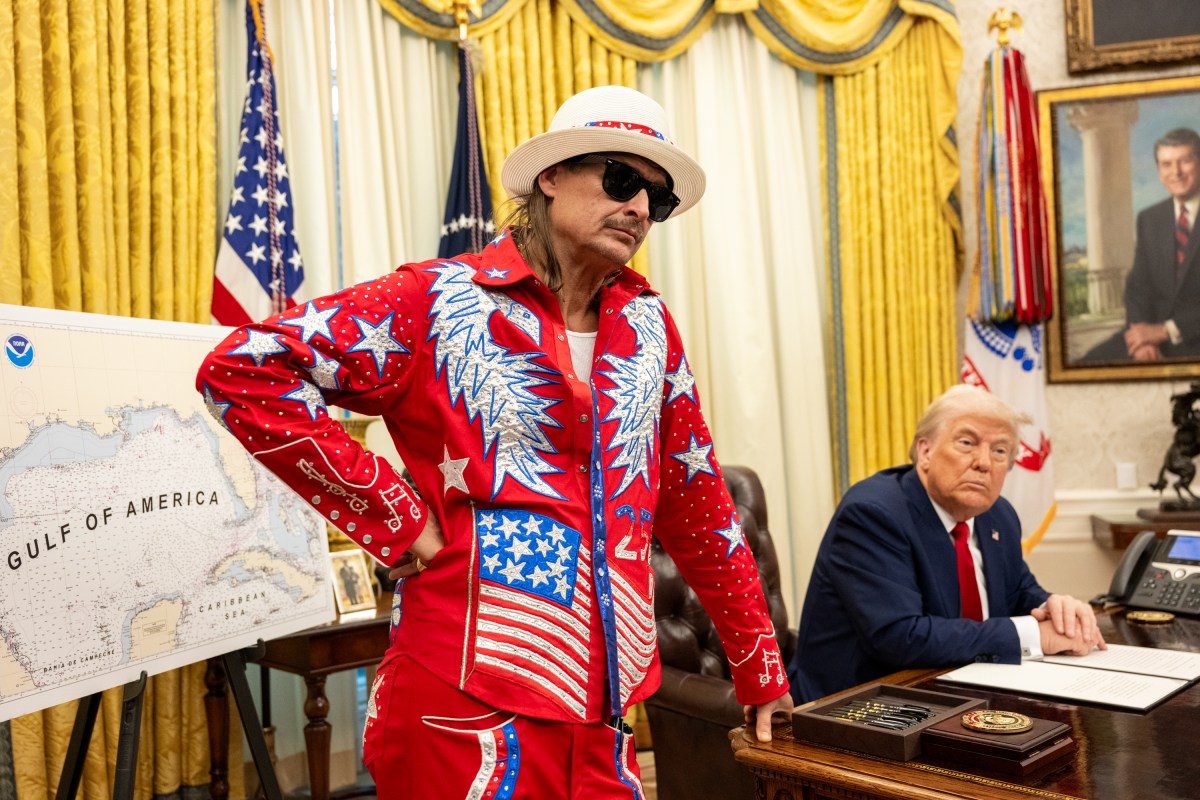 President Donald Trump signs an Executive Order alongside Kid Rock in the Oval Office, Monday, March 31, 2025. (Official White House Photo by Molly Riley)