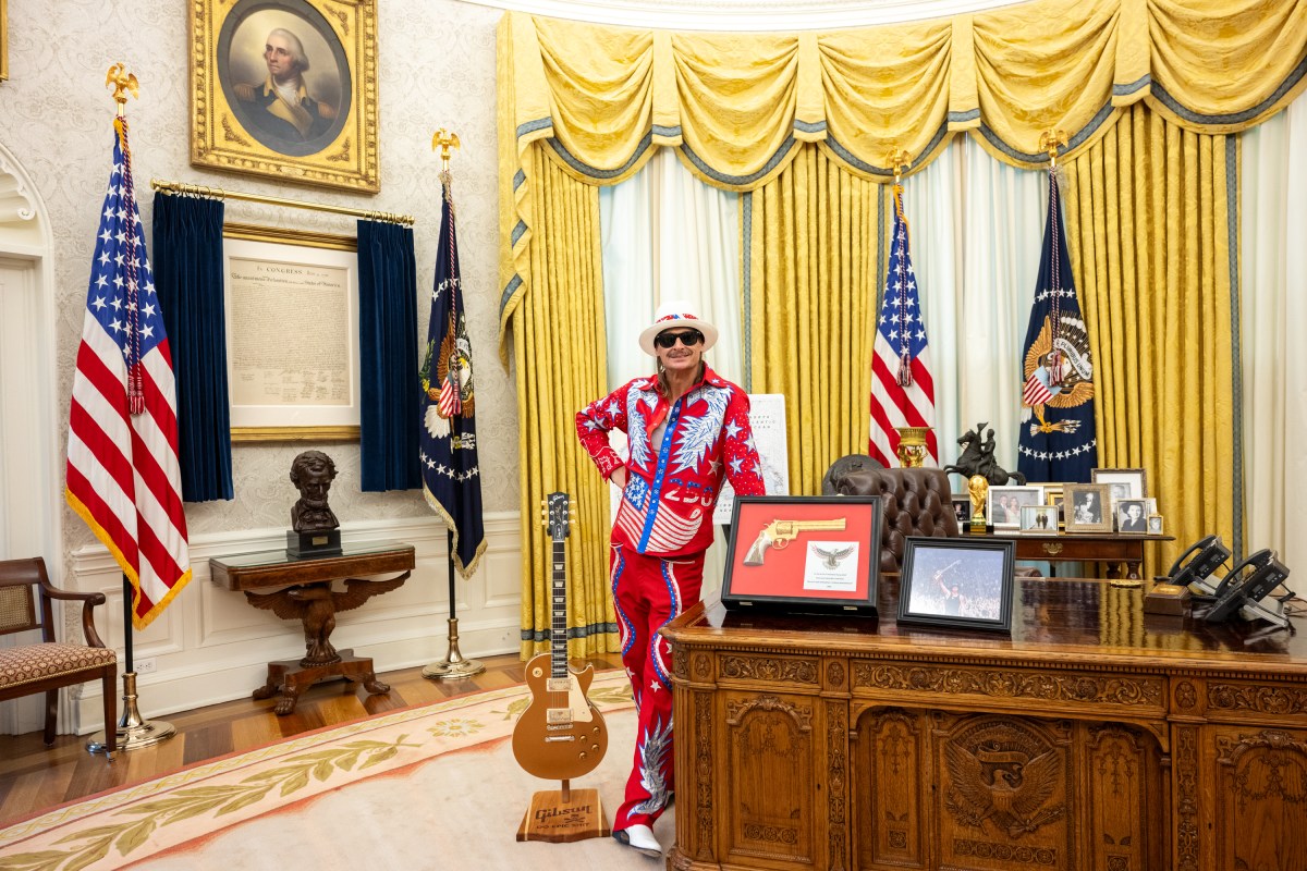 President Donald Trump signs an Executive Order alongside Kid Rock in the Oval Office, Monday, March 31, 2025. (Official White House Photo by Molly Riley)