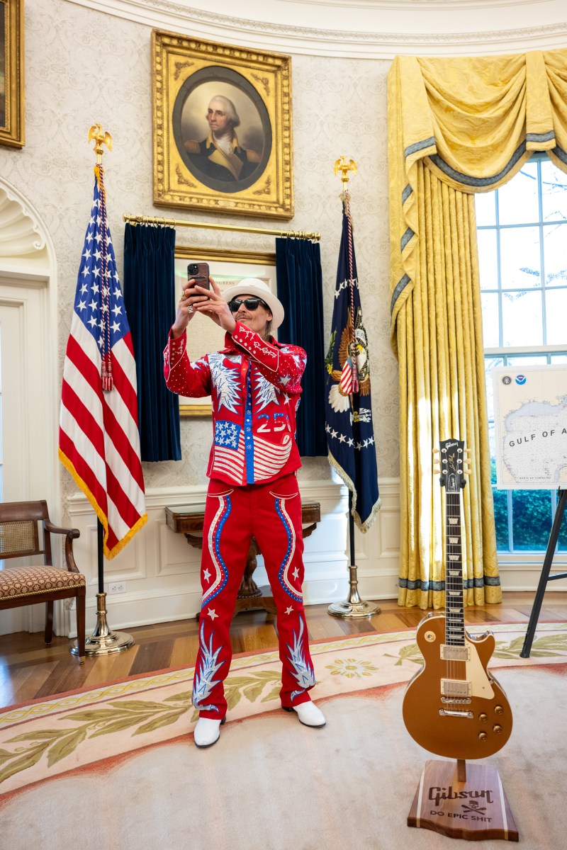 President Donald Trump signs an Executive Order alongside Kid Rock in the Oval Office, Monday, March 31, 2025. (Official White House Photo by Molly Riley)