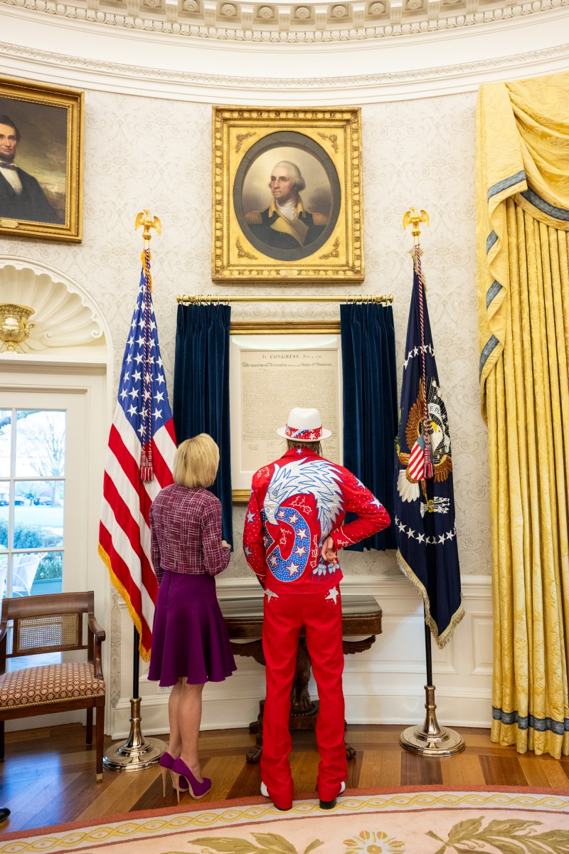 President Donald Trump signs an Executive Order alongside Kid Rock in the Oval Office, Monday, March 31, 2025. (Official White House Photo by Molly Riley)