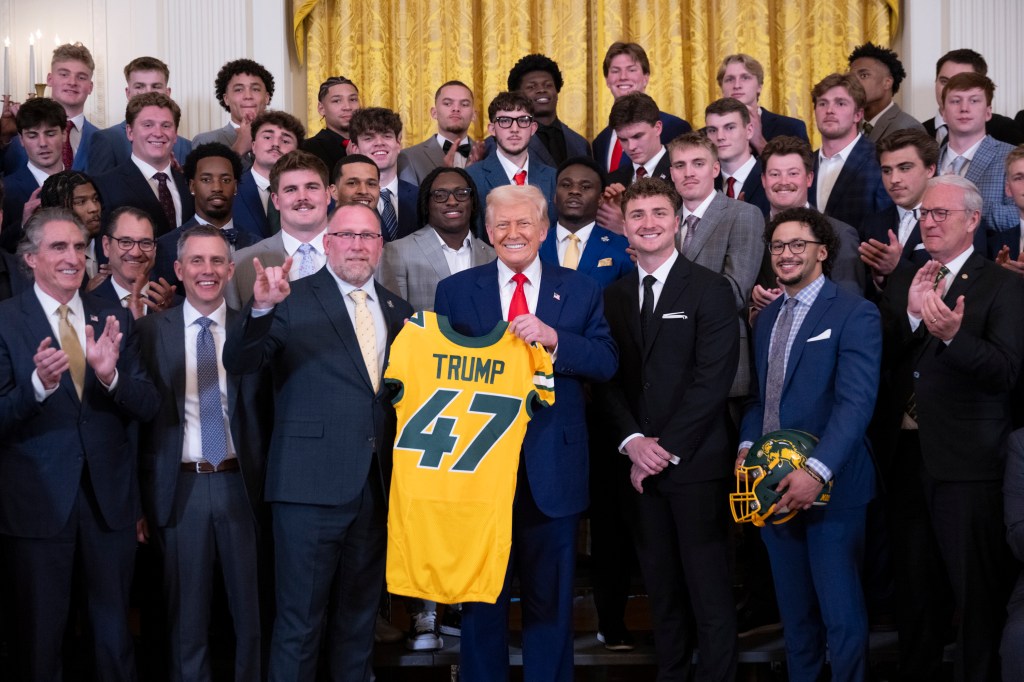 President Donald Trump poses for a photo with the North Dakota State University Bison football team, Wednesday, April 9, 2025, in the East Room of the White House. (Official White House Photo by Molly Riley)