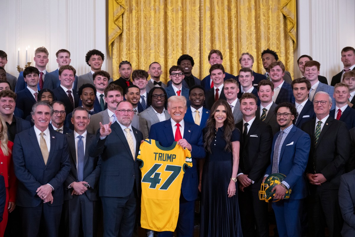 President Donald Trump poses for a photo with the North Dakota State University Bison football team, Wednesday, April 9, 2025, in the East Room of the White House. (Official White House Photo by Molly Riley)