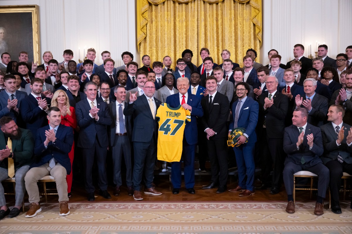 President Donald Trump poses for a photo with the North Dakota State University Bison football team, Wednesday, April 9, 2025, in the East Room of the White House. (Official White House Photo by Molly Riley)