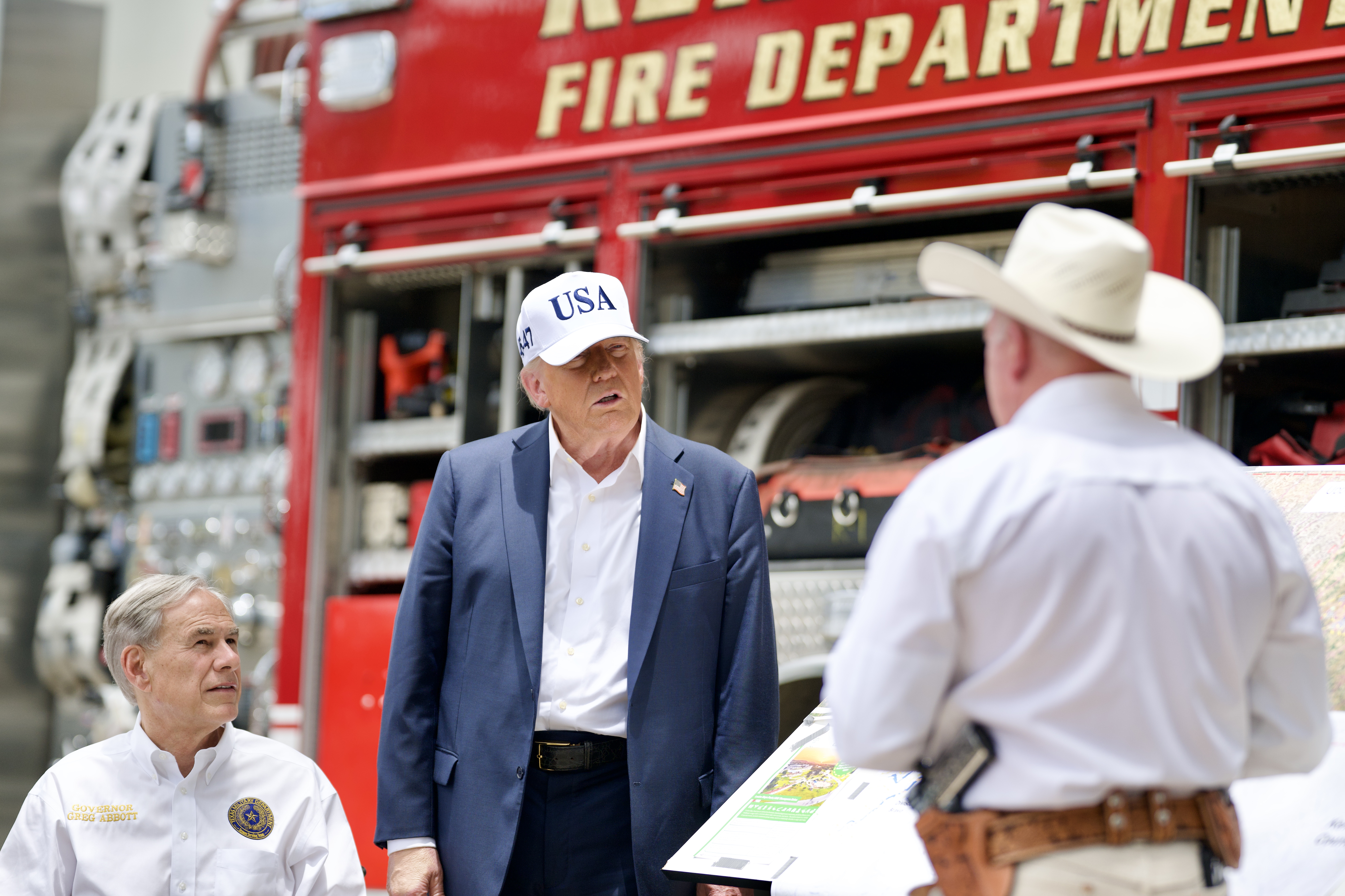 President Donald Trump and Texas Gov. Greg Abbott meet with first responders and local officials at Louise Hays Park in Kerrville, Texas on Friday, July 11, 2025. (Official White House Photo by Daniel Torok)