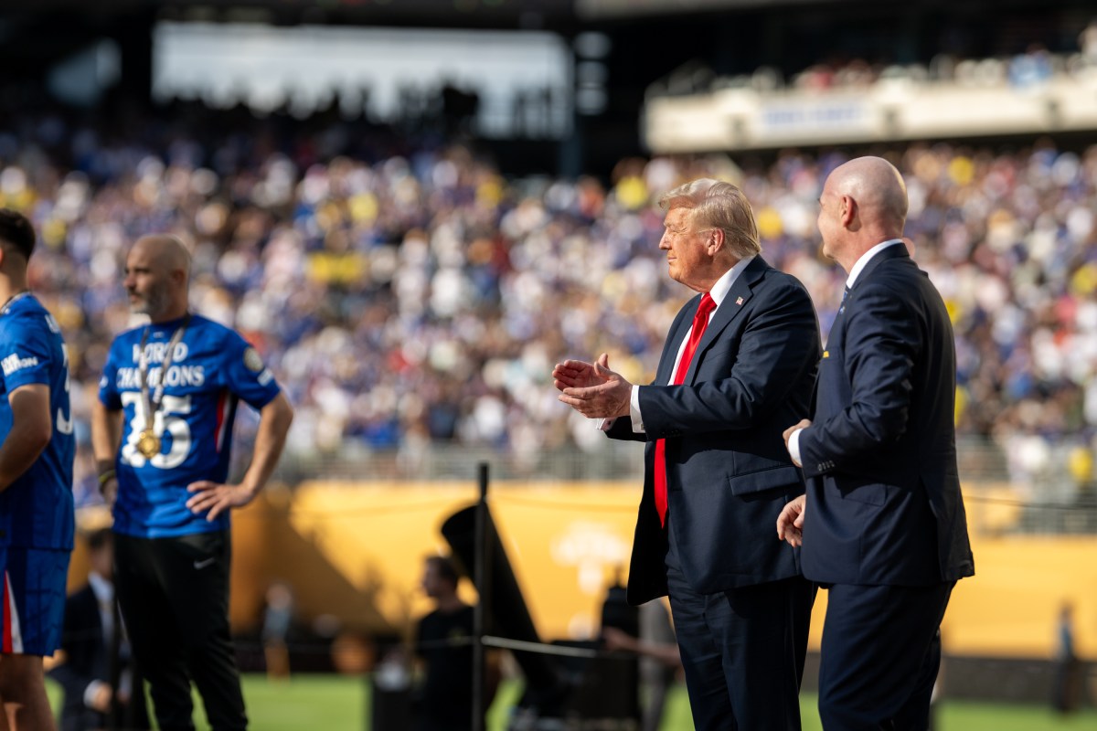 President Donald Trump gestures to the crowd as he departs the FIFA World Cup Final alongside FIFA President Gianni Infantino, Sunday, July 13, 2025, at MetLife Stadium in East Rutherford, New Jersey. (Official White House Photo by Daniel Torok)