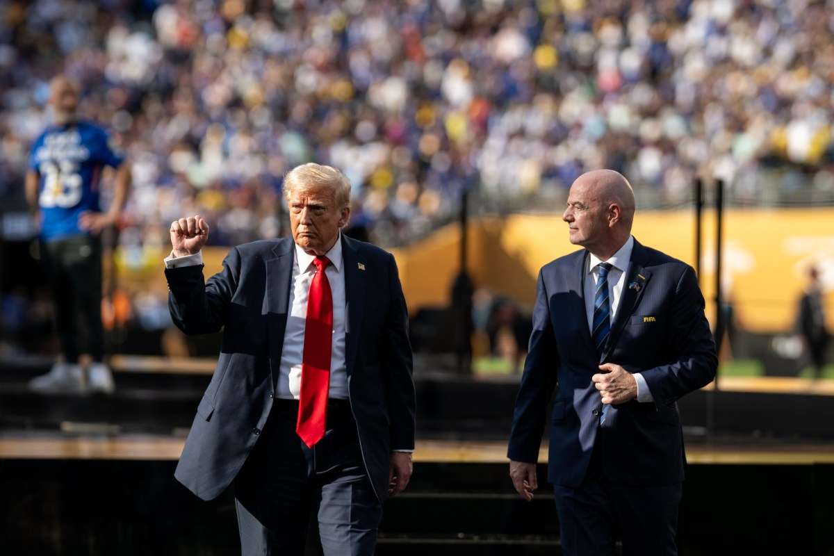 President Donald Trump gestures to the crowd as he departs the FIFA World Cup Final alongside FIFA President Gianni Infantino, Sunday, July 13, 2025, at MetLife Stadium in East Rutherford, New Jersey. (Official White House Photo by Daniel Torok)