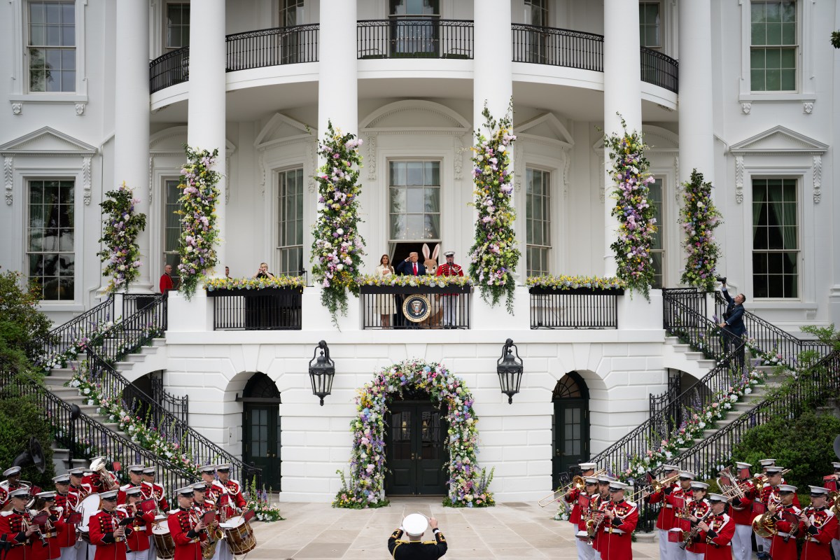 President Donald Trump and First Lady Melania Trump are accompanied by the Easter Bunny as they wave to the crowd from the Blue Room Balcony, Monday, April 21, 2025, during the annual White House Easter Egg Roll on the South Lawn. (Official White House Photo by Andrea Hanks)