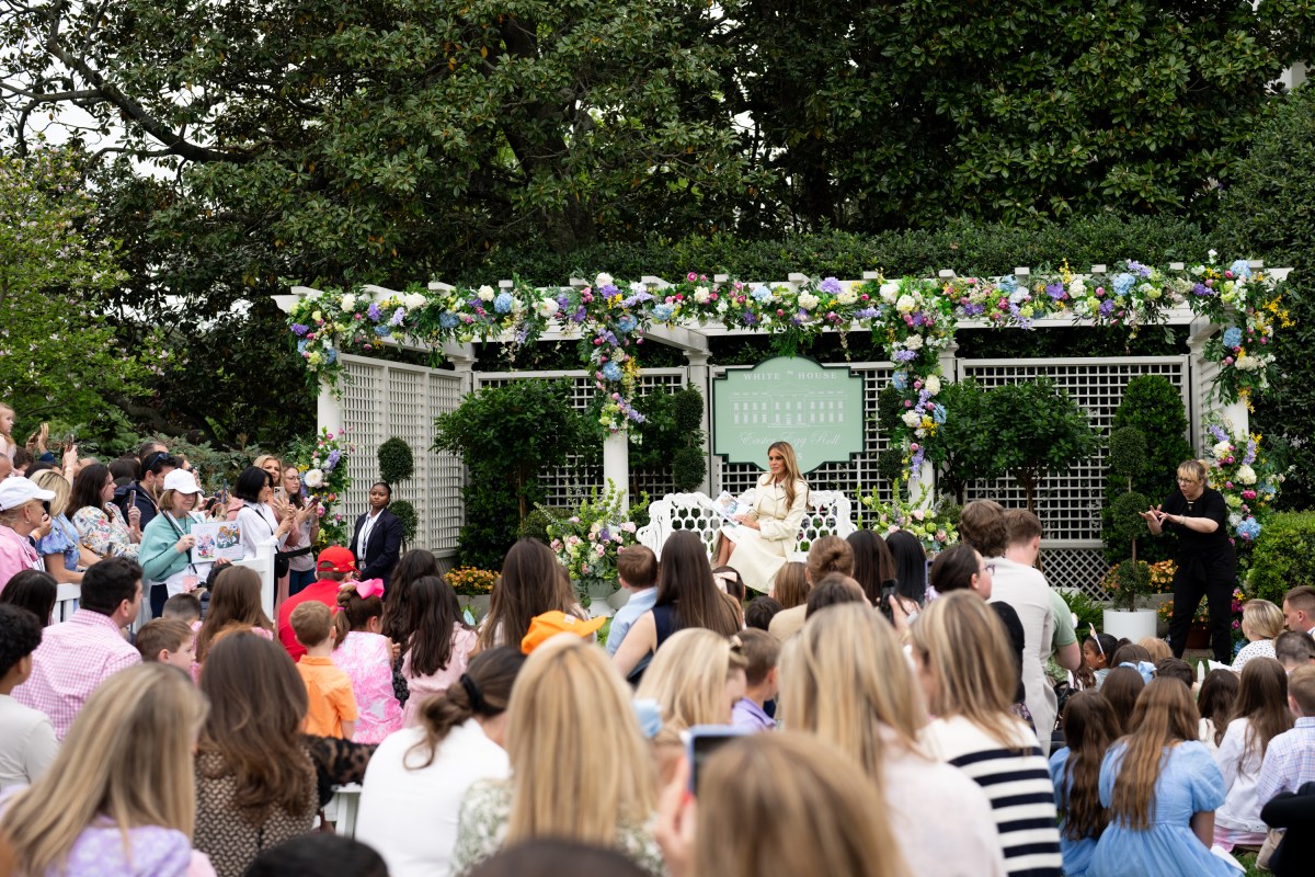 First Lady Melania Trump reads a book at the Reading Nook in the First Ladies Garden during the White House Easter Egg Roll, Monday, April 21, 2025, on the South Lawn. (Official White House Photo by Andrea Hanks)