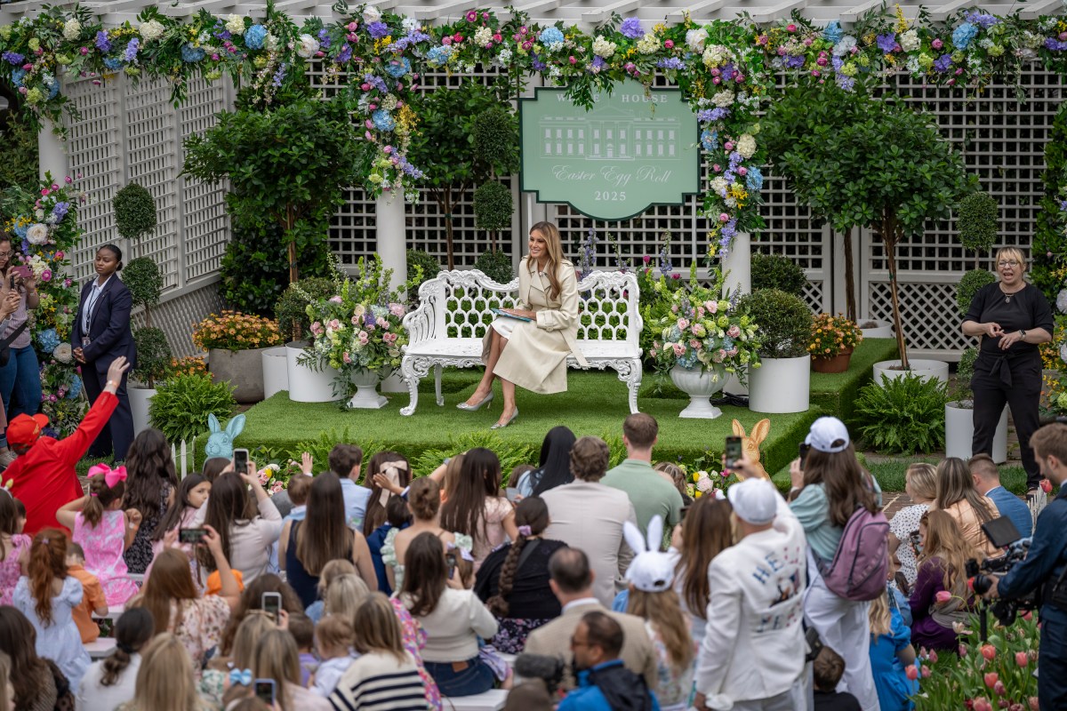 First Lady Melania Trump reads a book at the Reading Nook in the First Ladies Garden during the White House Easter Egg Roll, Monday, April 21, 2025, on the South Lawn.(Official White House Photo by Carlos Fyfe)