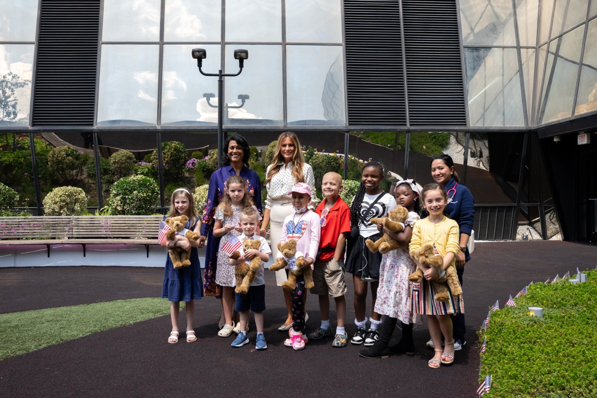 First Lady Melania Trump poses for a photo with young patients in the Bunny Mellon Healing Garden at Children’s National Hospital in Washington, D.C., Thursday, July 3, 2025.(Official White House Photo by Andrea Hanks)