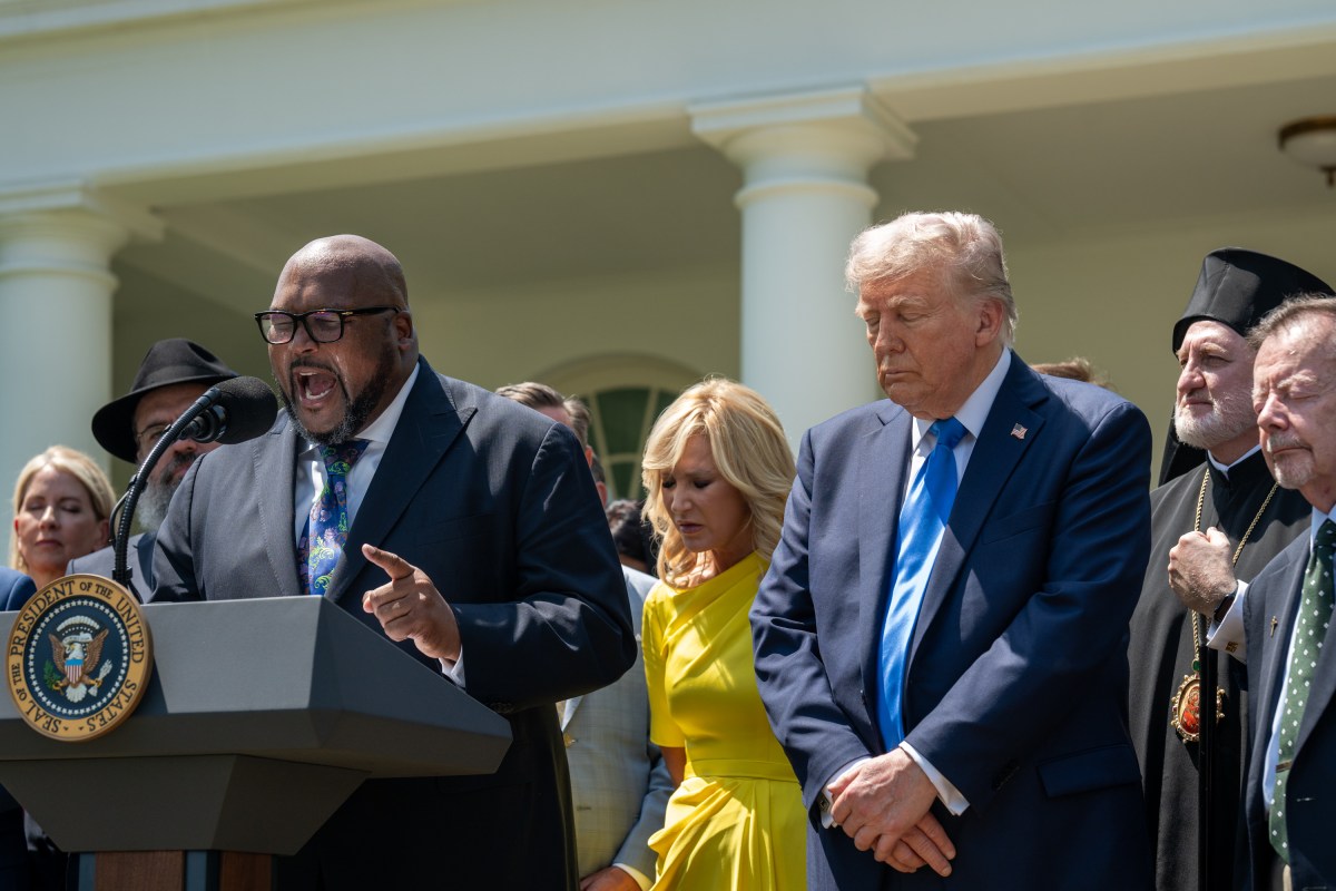 Bishop Kelvin Cobaris delivers a prayer alongside President Donald Trump during a National Day of Prayer event, Thursday, May 1, 2025, in the White House Rose Garden. (Official White House Photo by Joyce N. Boghosian)