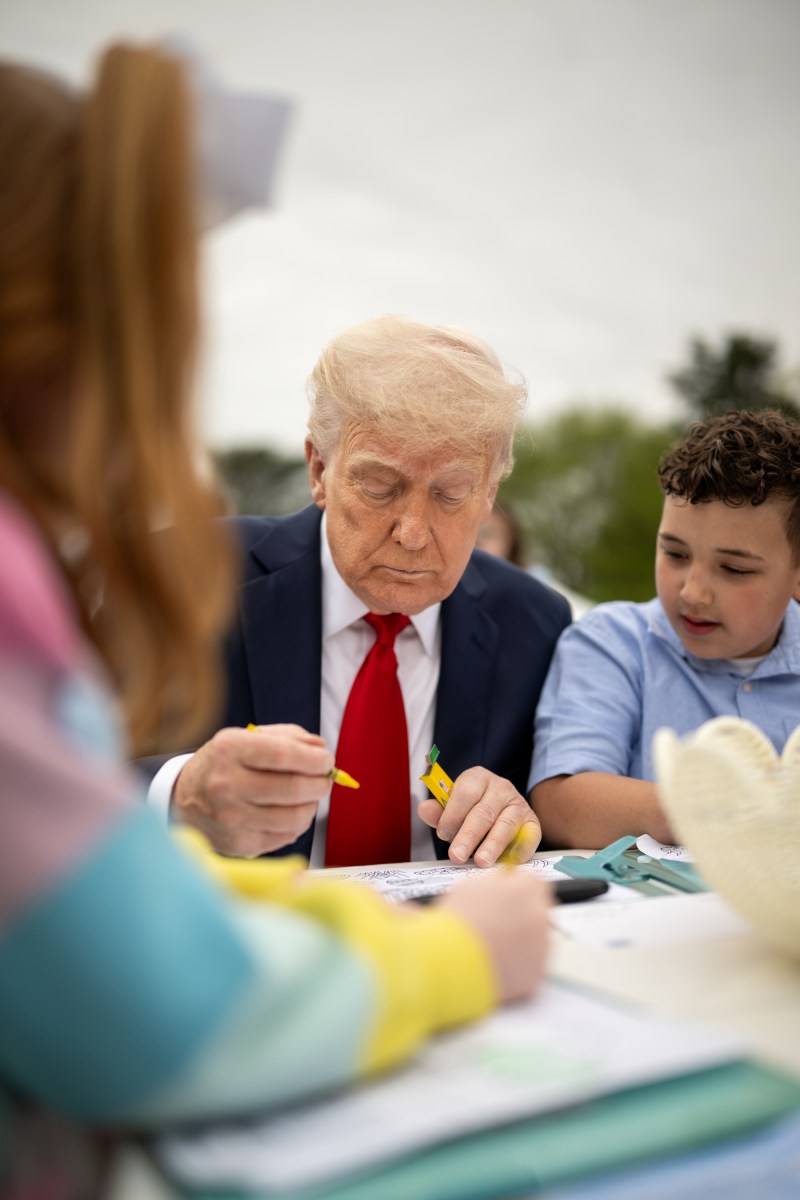 President Donald Trump colors with children at the White House Easter Egg Roll, Monday, April 21, 2025, on the South Lawn. (Official White House Photo by Daniel Torok)