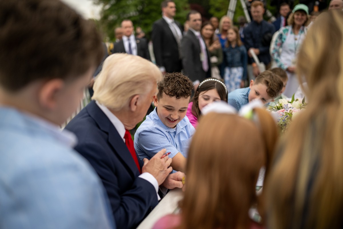 President Donald Trump colors with children at the White House Easter Egg Roll, Monday, April 21, 2025, on the South Lawn. (Official White House Photo by Daniel Torok)